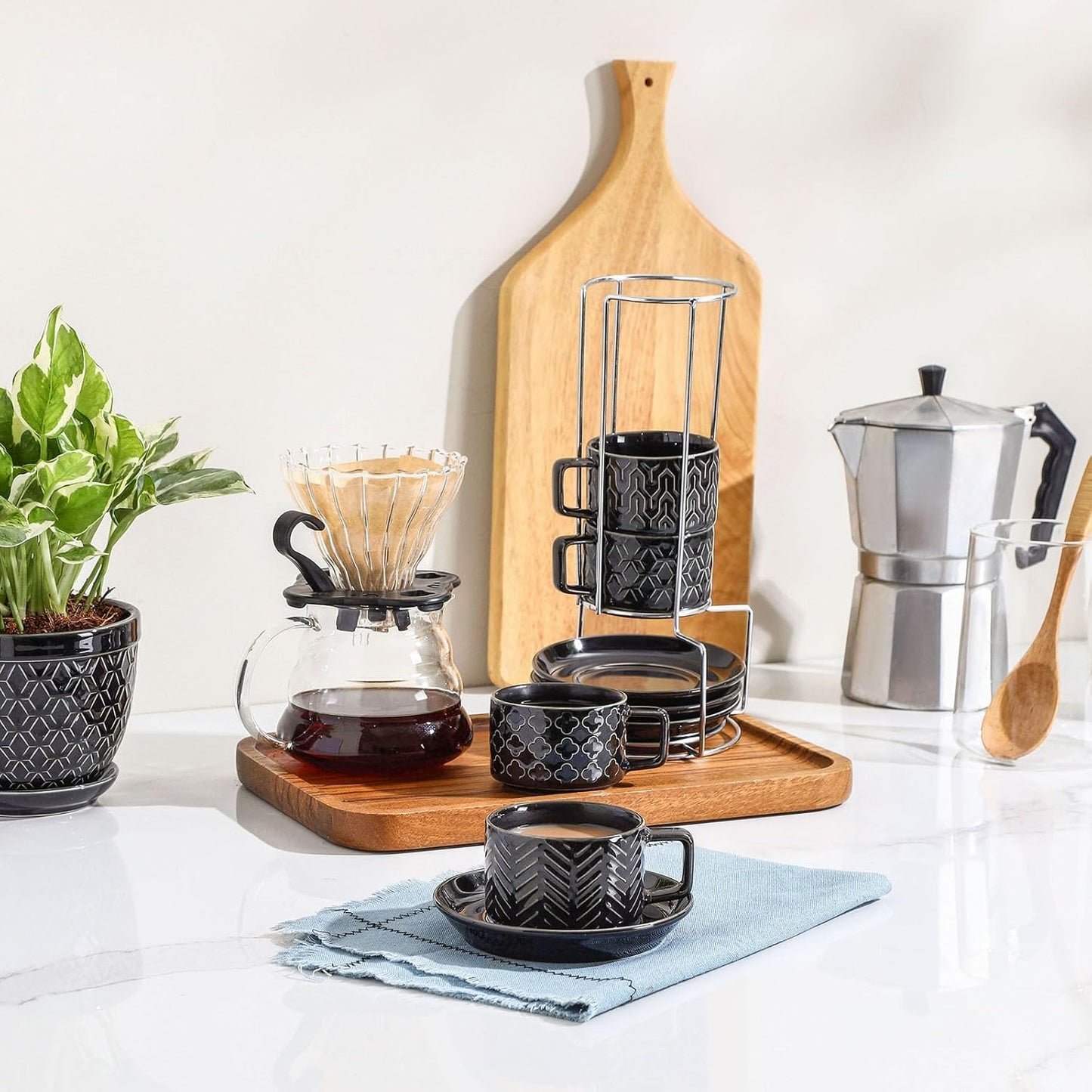 Sureasy Ceramic Espresso Cups Set of 4 – 4 oz Black Stackable Cappuccino Cups with Saucers and Metal Stand, Embossed Mugs for Latte, Mocha, Tea, and Specialty Coffee