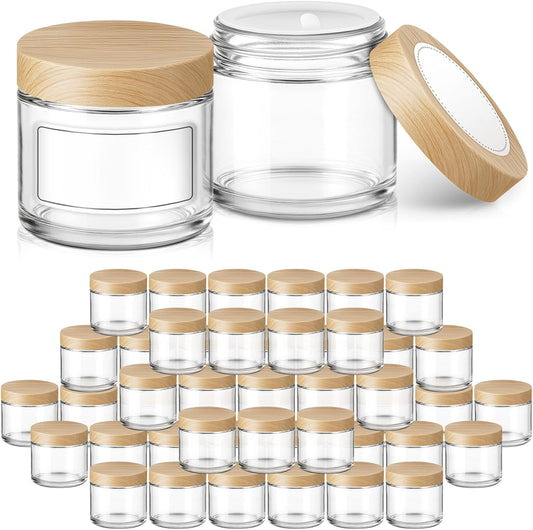 2 oz Glass Jars with Plastic Woodgrain Lids, Bumobum 48 pack Round Clear Cream Jars with Black and White Labels & Inner Liners, Empty Cosmetic Containers for Cream, Lotion, Ointment
