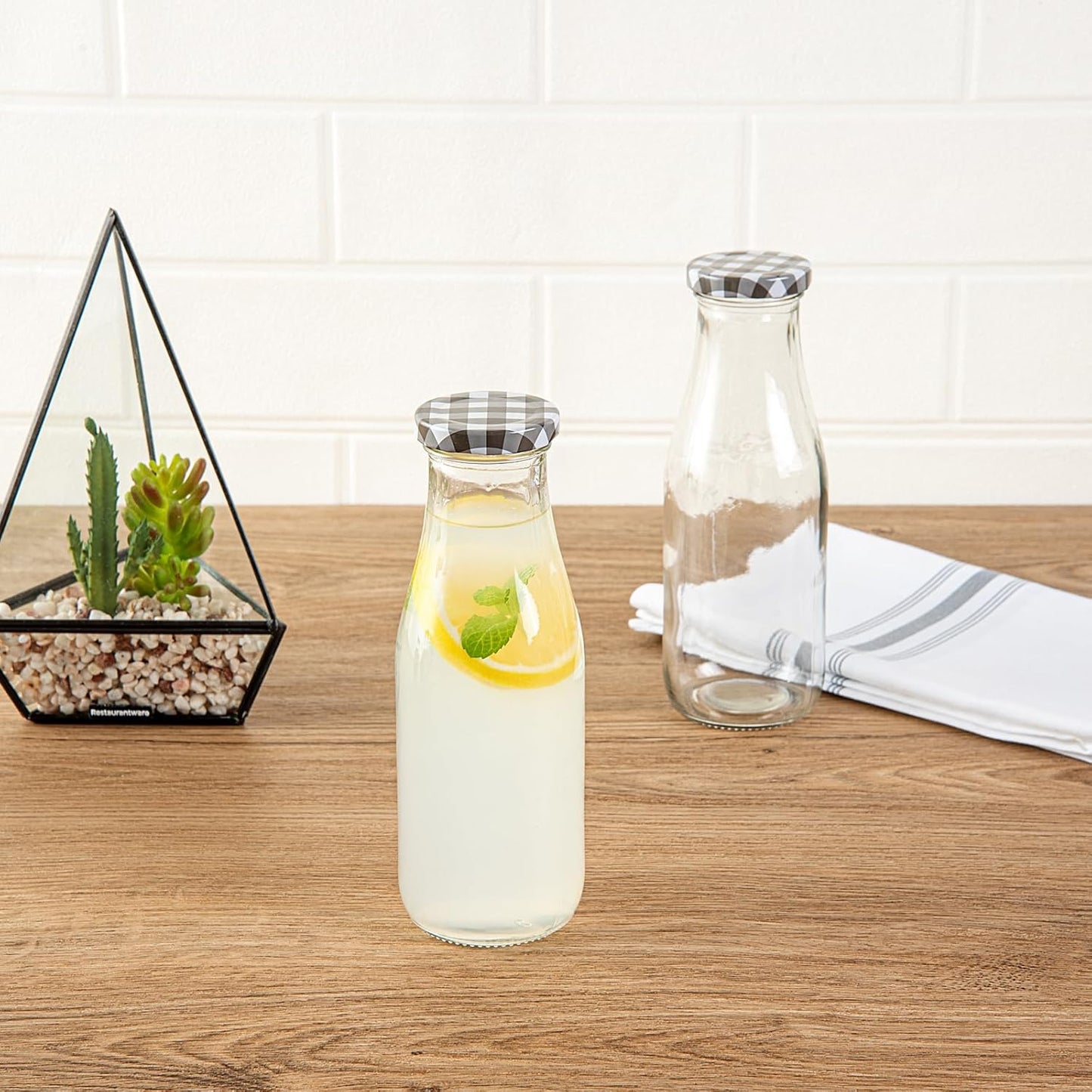 Restaurantware French Countryside 15 Ounce Glass Bottles 10 Durable Juice Bottles - With Black Plaid Lid Dishwashable Clear Glass Countryside Bottles For Hot And Cold Beverages